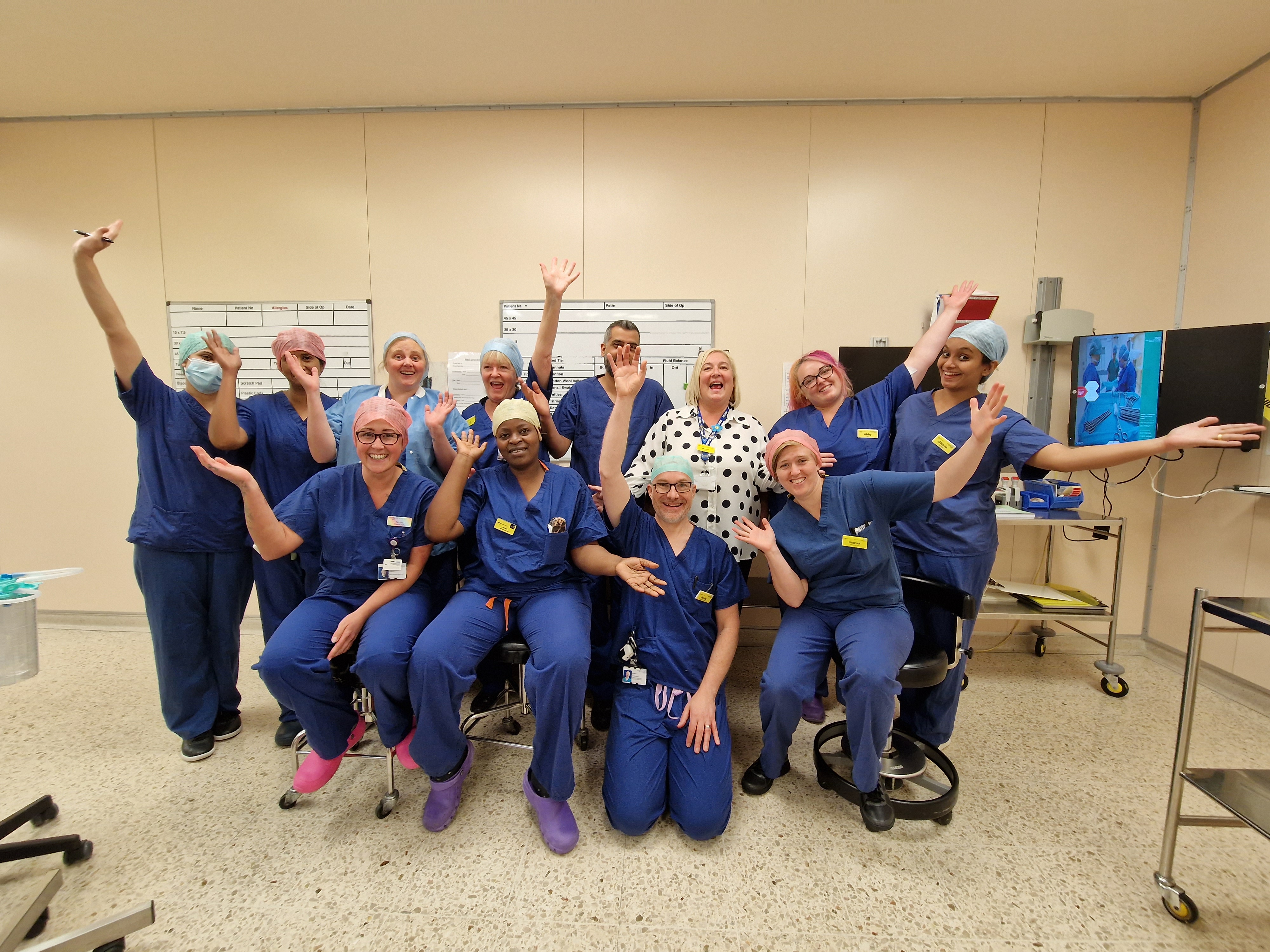 Group of theatre practitioners and ODPs wearing scrubs